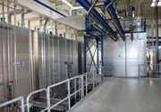 The part-automated powder coating system features a flexible transport facility with lifting and lowering stations and a waste water-free two-chamber pretreatment plant
