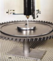 Rotating lance, which peens the interior of holes down to 0.8 centimeters in diameter, can be quickly positioned with Y-axis linear controls.