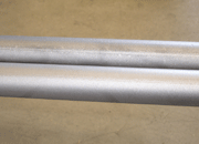 Metal surfaces after blasting upper one without additive, below with additive