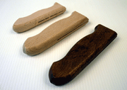 Wooden knife hilts, from top left to bottom right: raw, Vibrodry smoothed, vibro-waxed after varnishing