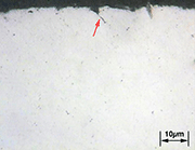 Figure 5 - Metallography of spring surface. Material SAE 9254. Arrows indicate several surface overlaps of 12 to 15