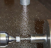 Shot peening of a titanium sample