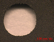 Fig. 8: An example of drilling to CFRP plate, an SEM image
