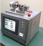 Fig. 5 Photograph of load-controlled plate-bending fatigue tester