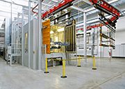 AGTOS tunnel-type blast system for processing structures prior to being coated with powder