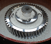 A Centerless Vibratory finishing unit type SMR-D-120-SF, processing a steel gear weighing about 250 kg.