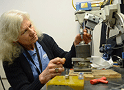 Beth Matlock puts the finishing touch on a sample setup for residual stress measurement