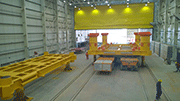Inside view of painting room and view into blasting room of Custom Coating Facility for an offshore fabrication yard
