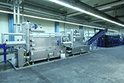 Picture 6: Spray washing machine for de-oiling directly linked with blanking and forming press and mass finishing machine