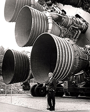Wernher von Braun in front of his Saturn V rocket