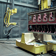 Fully automated blast cleaning of large die-cast engine blocks
