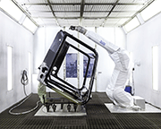 An automatic turning and tilting frame moves the body into the correct position for painting
