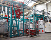 Two AGTOS hanger-type blast machines of type HT 11-13 for pretreating fasteners (rack goods) prior to Geomet® coating