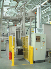 Overall view of a drum blasting machine with loading device