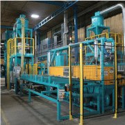 Work handling system integrated with blast machine to clean tube IDs