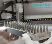 Figure 3: One of the trays with dental implants awaiting surface treatment in the DentalBlast 900 by FerroECOBlast®
