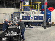A THM 400 shot blast machine in the TTC test and training center in Grand Rapids/USA is loaded with aluminum die-castings for the automotive industry