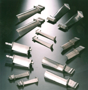 Forged turbine blades are surface finished by different vibratory centrifugal and shotblasting processes.