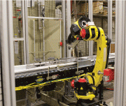 Indexing blast cabinet with load/unload robot for complete end-to-end processing solution