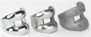 Photo 5: Femoral knee components at various finishing stages: (1) Raw investment casting, (2) After machining and surface smoothing, (3) Polished, ready for implantation