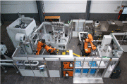 Photo 10: Automated surf-finishing system with robotic work piece handling