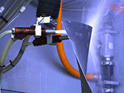 Vapormatt Cougar+ automatic 
wet blasting machine in vertical 
configuration blasting a fan blade