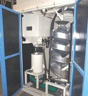 An important aspect of shot peening is precise classification of the shot peening media. This picture shows the single spiral separator for removing unusable media.