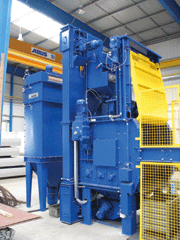 Tumble blast machine with loading device and filter system