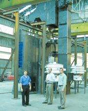 Deron Lock (center) with Ryan Sneath, Sales/Engineering (right)and Georges Hebert of 
Aerosphere (left) in front of the MR 7224 airless shotblaster used for peening aluminum parts.