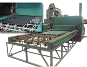 Special belt-conveyor machine blasts both sides of steel plates in a single pass. Machine is used to impart texture on plates for laminate manufacturing.
