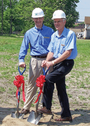 Paul W. Tousley, President, Manager and majority owner of Peerless (right side) and David J. Carter, Vice President (left side)