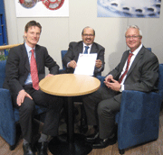 Pic. 6: Alwin Keiten-Schmitz, Dilip Thaker, representative of the IG Mint, and Thomas Hogenkamp with the undersigned contract on the Hannover fair
